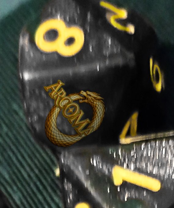 ArcoMage black-glitter d10 - gold embossed numbers and the ouroboros